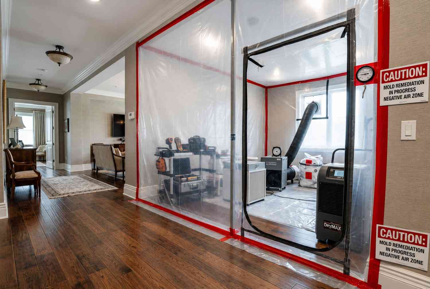 Professional mold remediation containment chamber inside a residential home featuring negative air pressure, HEPA filtration, and drying equipment. Certified mold removal specialists use containment barriers to prevent cross-contamination, improve indoor air quality, and safely restore water-damaged areas while supporting effective mold remediation and restoration services.