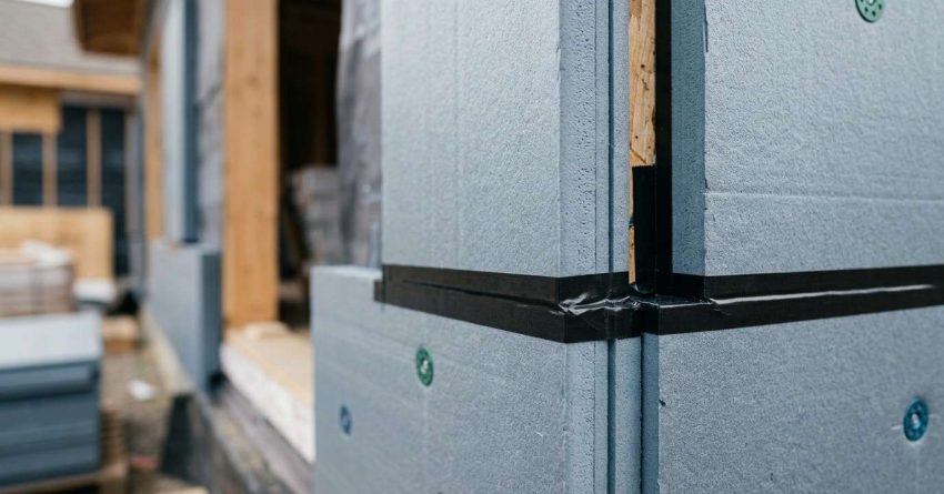 Continuous exterior insulation installation on a high-performance building wall.