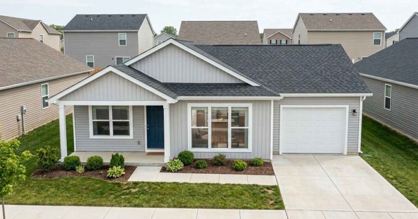 Modest newly built suburban home with practical design, standard finishes, attached garage, and efficient layout, representing the type of house that can realistically be constructed with a $200,000 building budget.