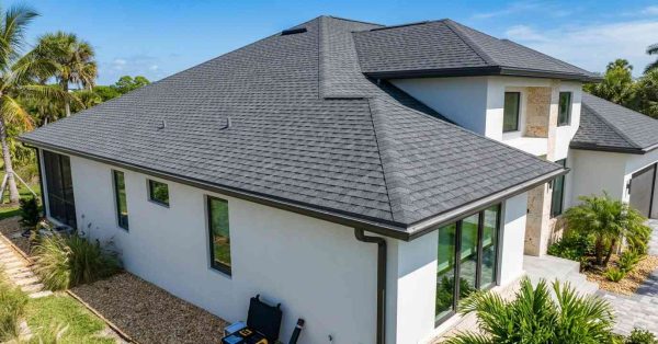 luxury Florida home built to modern hurricane-resistant building code with premium roofing and impact-resistant exterior features